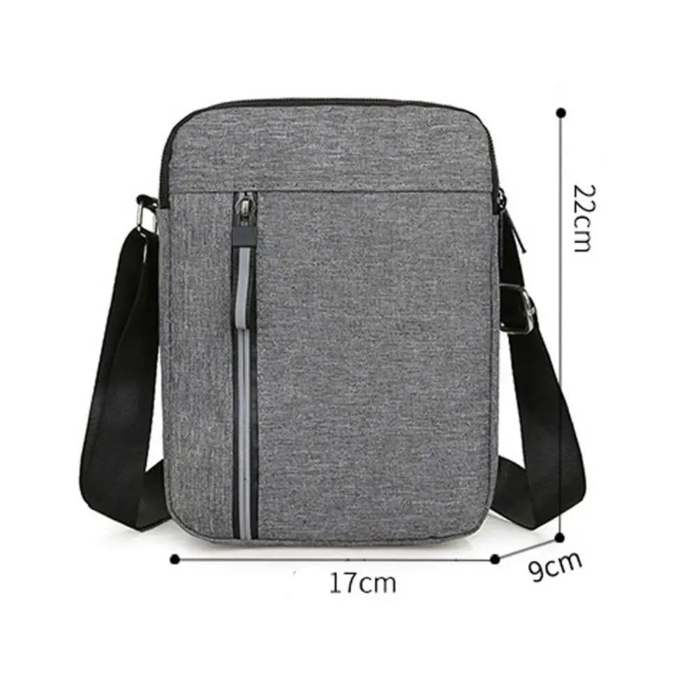 A gray durable waterproof crossbody bag shown with dimensions of 22cm by 17cm.
