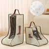 A pair of beige waterproof boot storage bags are displayed on a light surface.