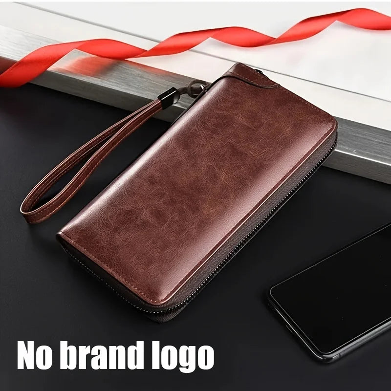 A brown PU leather zipper wallet is shown lying on a dark surface next to a smartphone and a red ribbon.