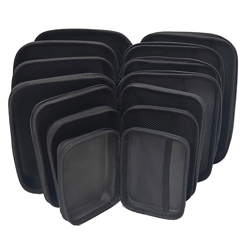 A set of black portable EVA storage and travel organizer bags stacked together.