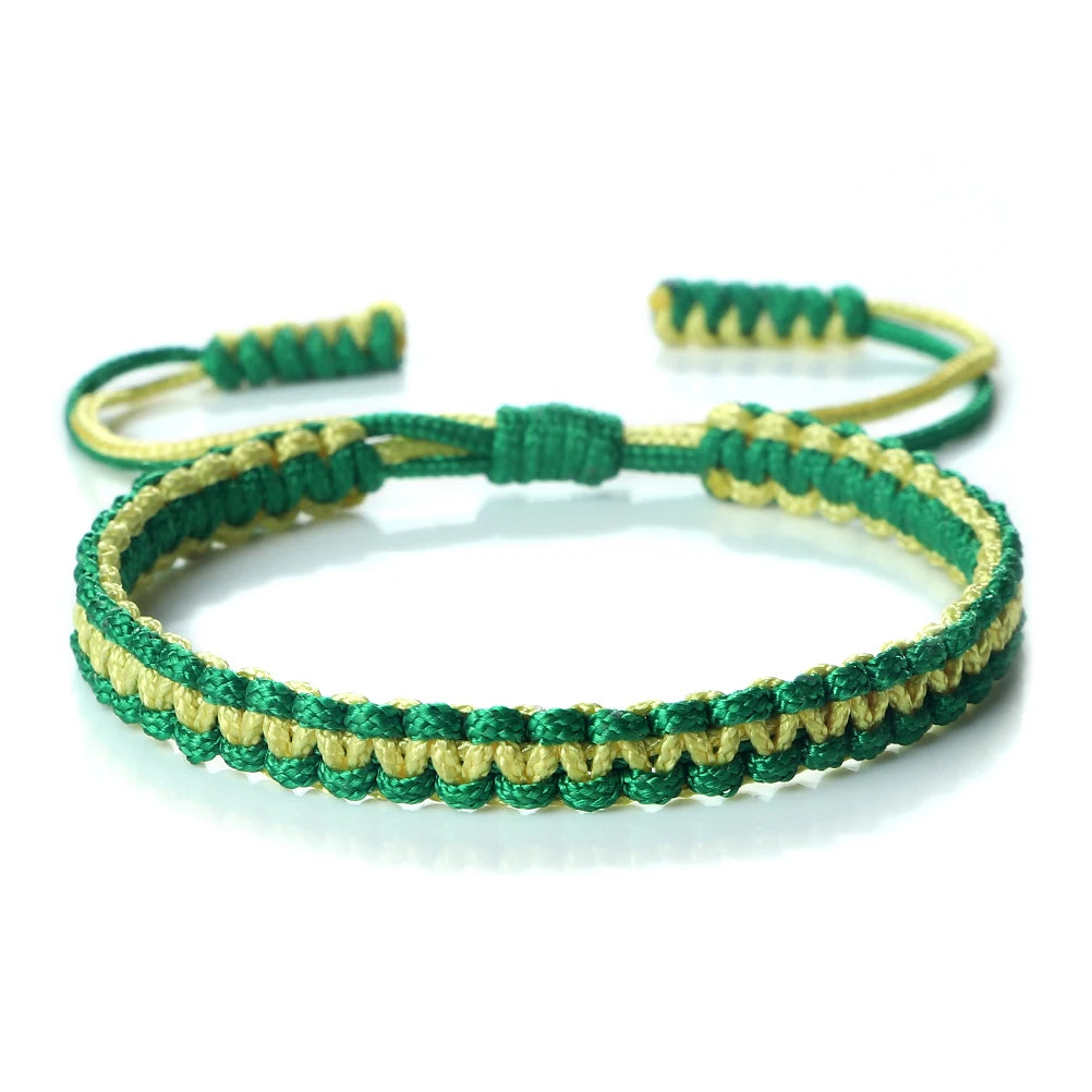 Handmade braided rope bracelet with green and yellow threads, featuring adjustable knots.
