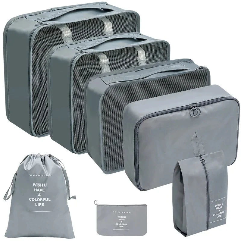 A set of gray fabric storage organizers and a matching drawstring bag for organizing items.