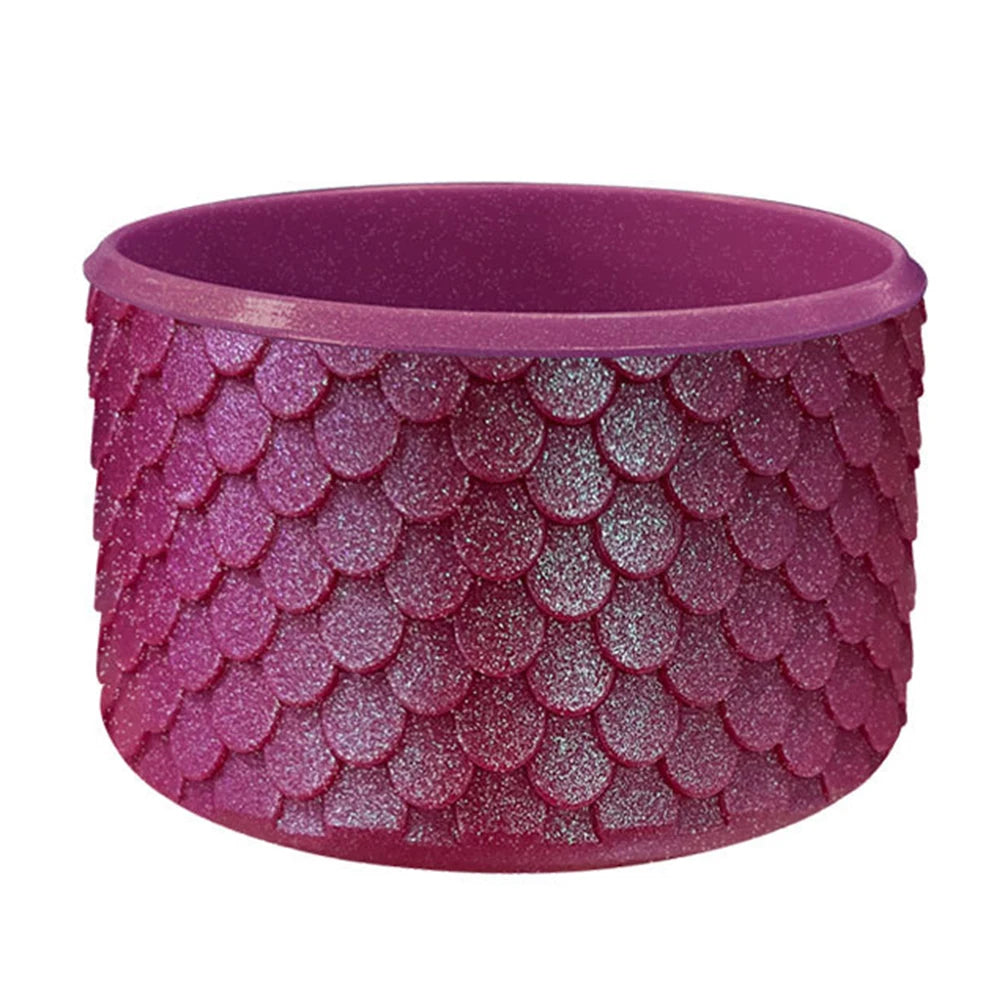 A purple silicone boot sleeve designed to fit water bottles.