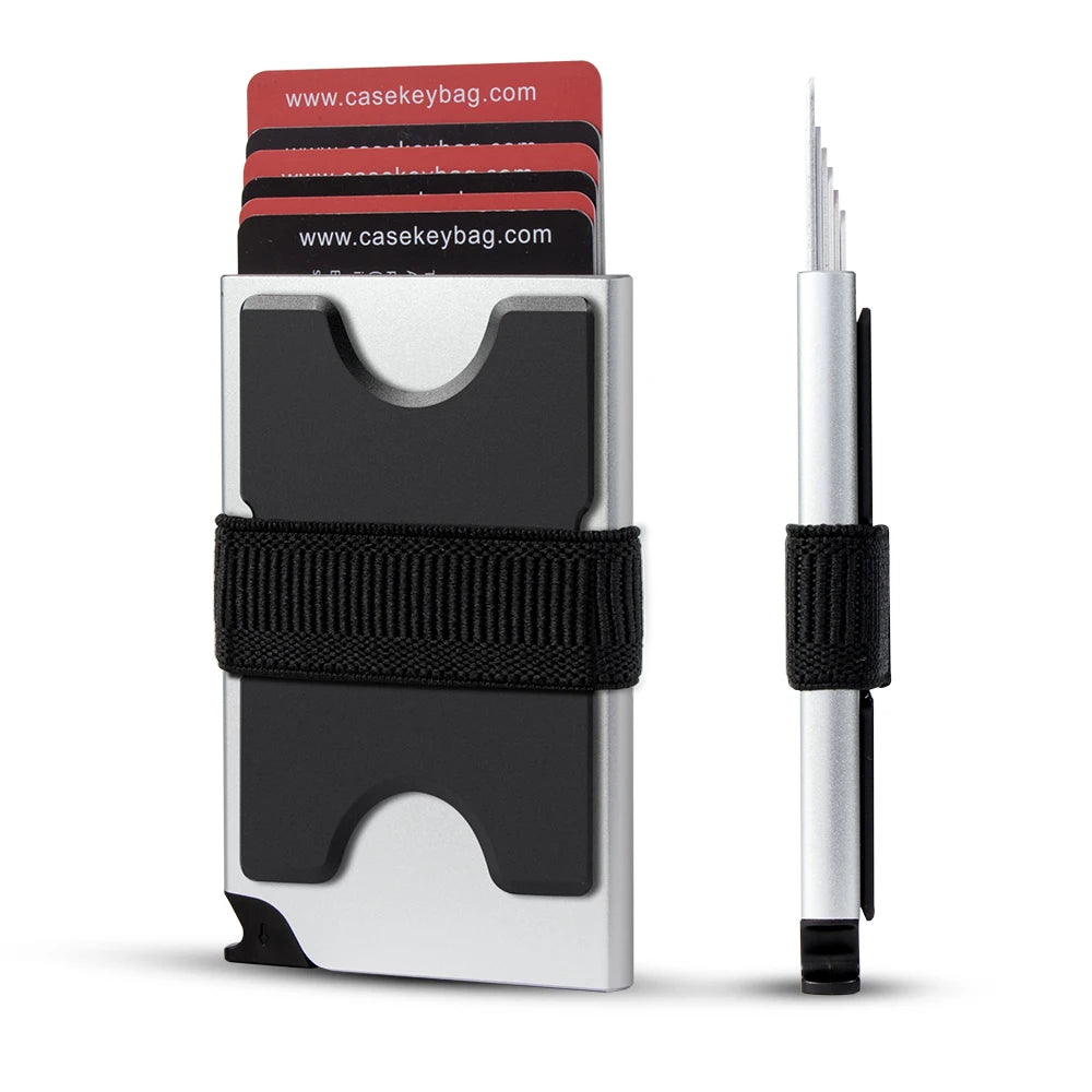 A silver metal pop-up card wallet with a black strap and several cards visible.