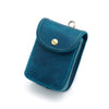 A teal leather waist bag with gold hardware shown from above.