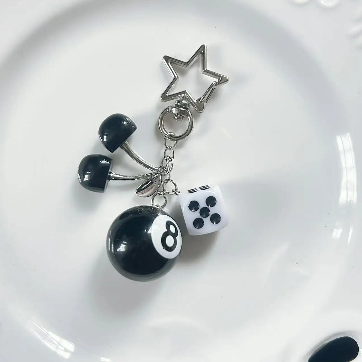 Silver Y2K 8 Ball keychain charm featuring a black and white billiard ball design.