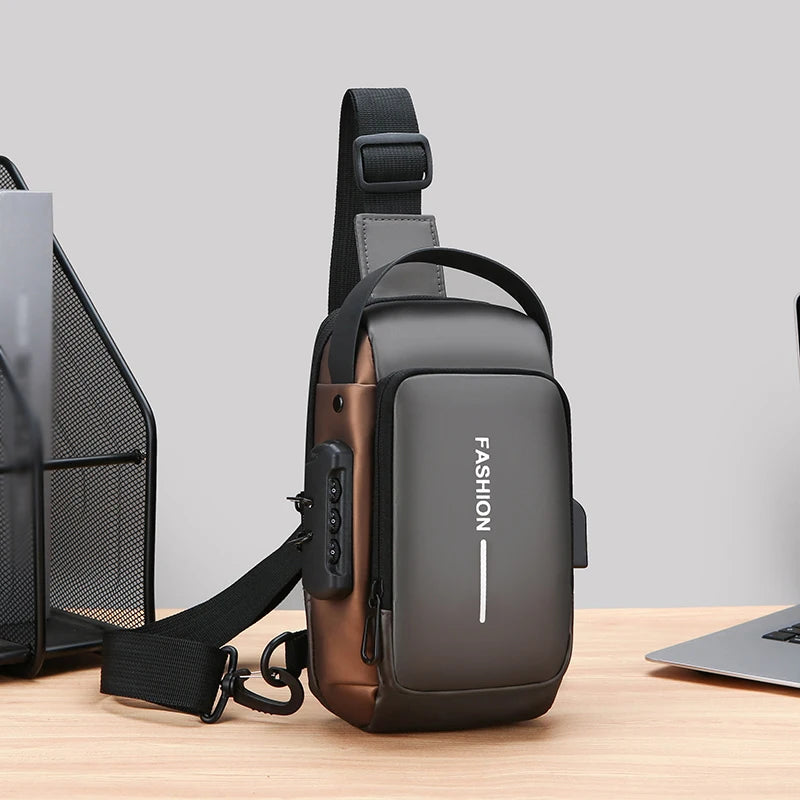 A dark brown men's oxford sling chest bag with a padded strap and a dedicated phone pocket resting on a wooden surface.