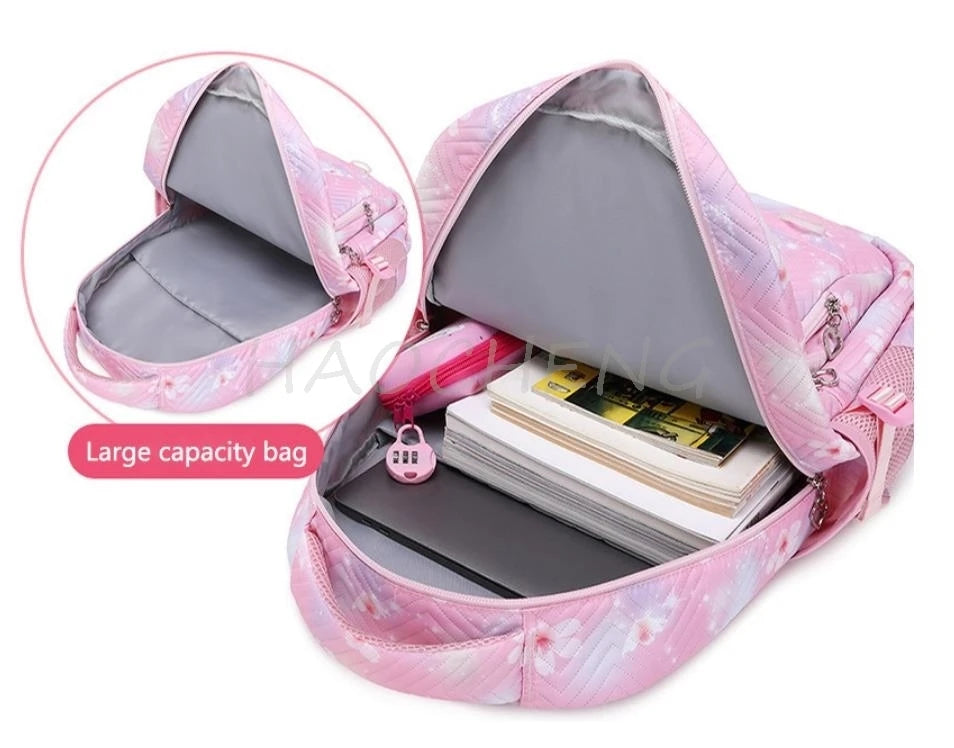 A pink floral patterned backpack is shown open, displaying its interior and capacity.