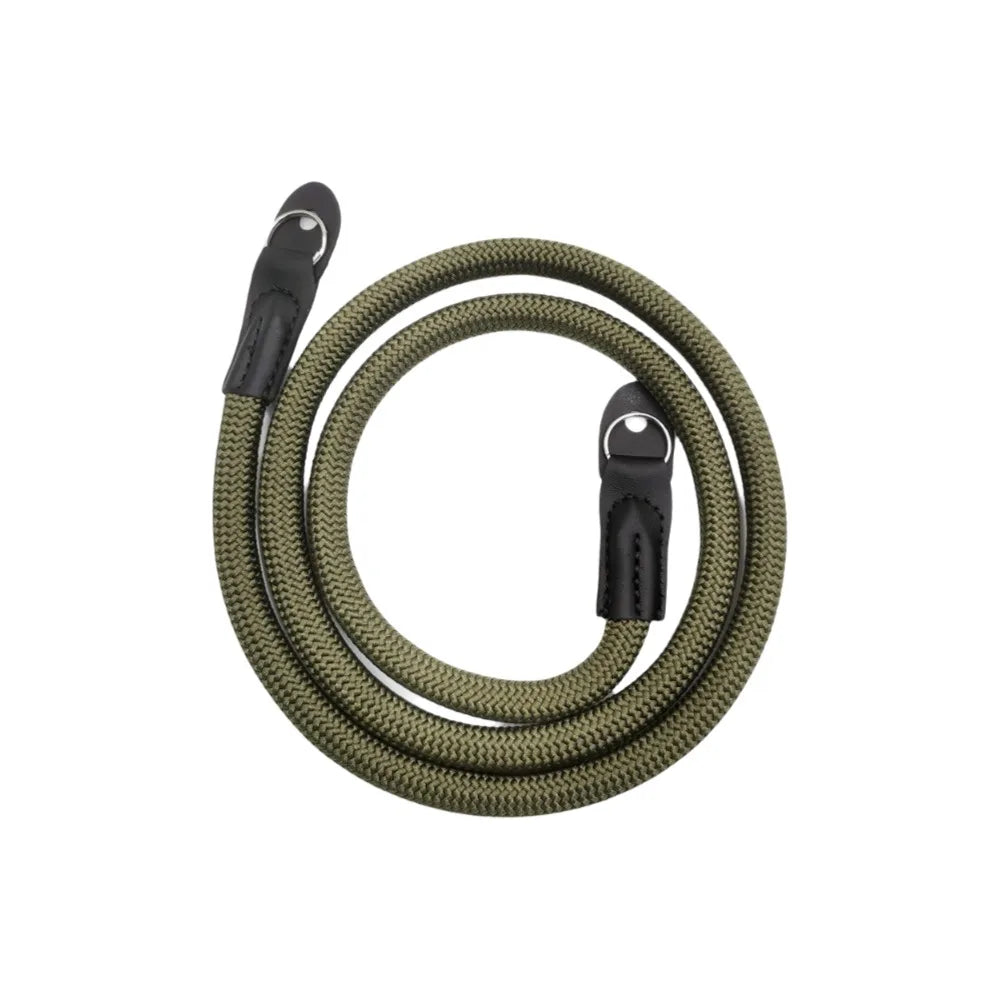 A coiled olive green adjustable camera and DSLR shoulder strap.