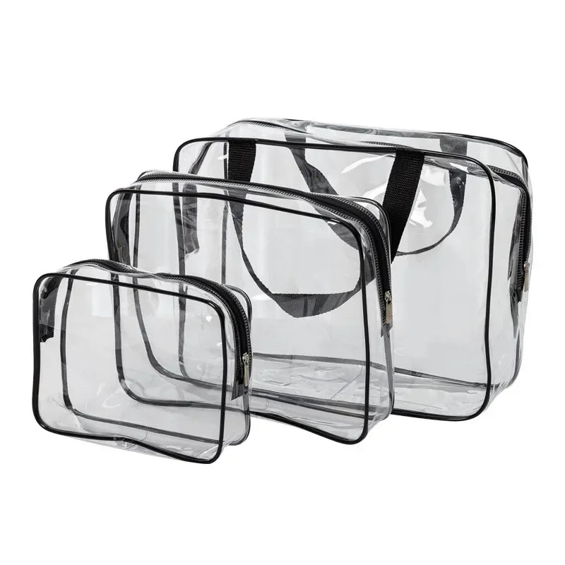 A set of three clear PVC travel toiletry bags with black straps.