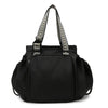 Black nylon shoulder bag with patterned straps and flap