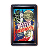 A vintage metal card holder featuring a colorful graphic titled Reefer Madness with images of marijuana victims.