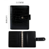 Black leather A7 crocodile ring binder notebook shown in profile view