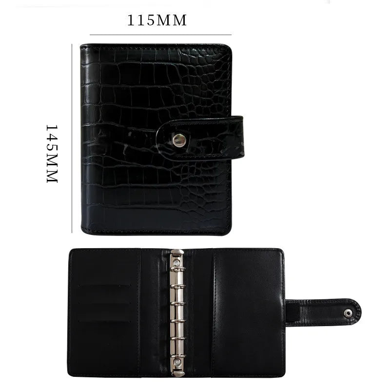 Black leather A7 crocodile ring binder notebook shown in profile view