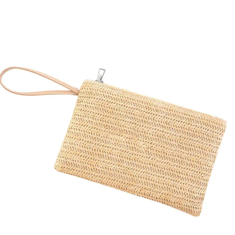 Handwoven straw makeup bag with a zipper and leather strap