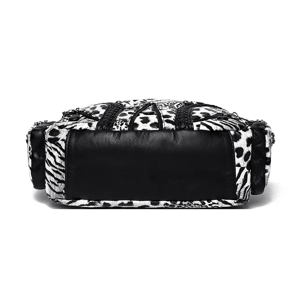 A black and white leopard print PU leather tote bag with a black leather flap.