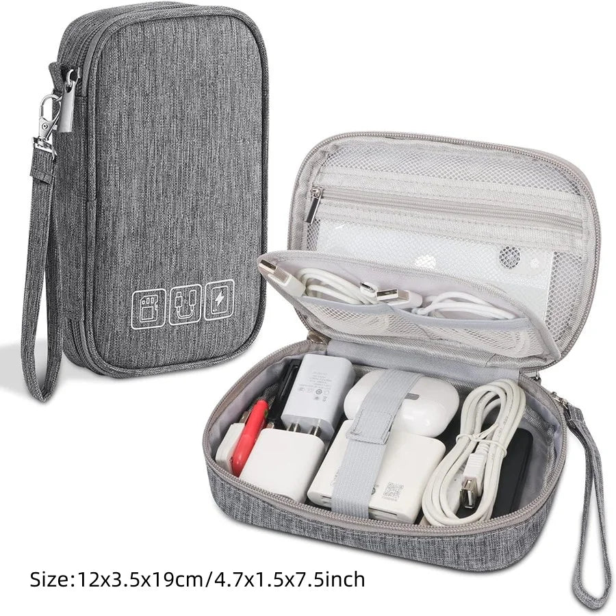 A gray portable digital organizer storage pouch with an open compartment showing various electronic accessories.