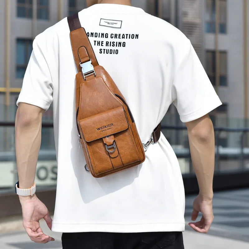 A man wearing a white t-shirt with a brown leather belt sling chest bag attached to his waist.