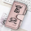 Cartera de cuero sintético rosa con cierre de cremallera y silueta negra de cara de oveja y la palabra 'forever'.