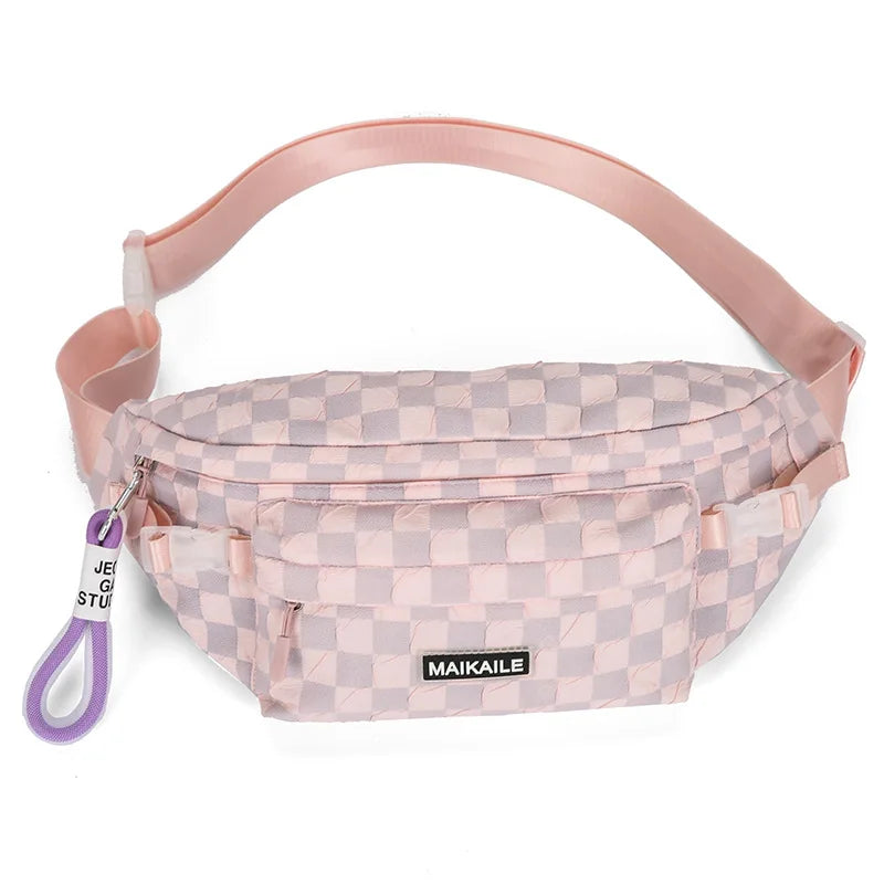 A pink plaid crossbody chest bag with an adjustable strap and a purple cord.