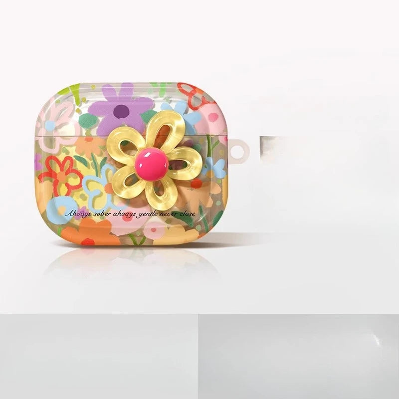 A colorful, floral-patterned earphone case with a yellow flower design.