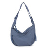 A soft blue nylon crossbody shoulder bag with an adjustable strap.