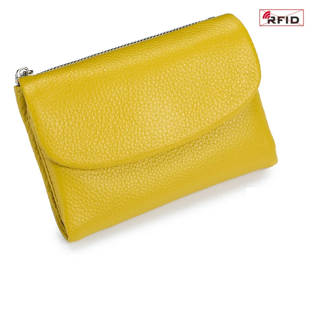 A yellow genuine leather mini card holder wallet with a zipper closure.