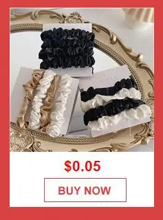 A close-up of a bohemian layered bag chain featuring black and white ruffled fabric for handbags.