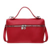 A red pebbled leather box crossbody bag with a silver zipper and hardware.