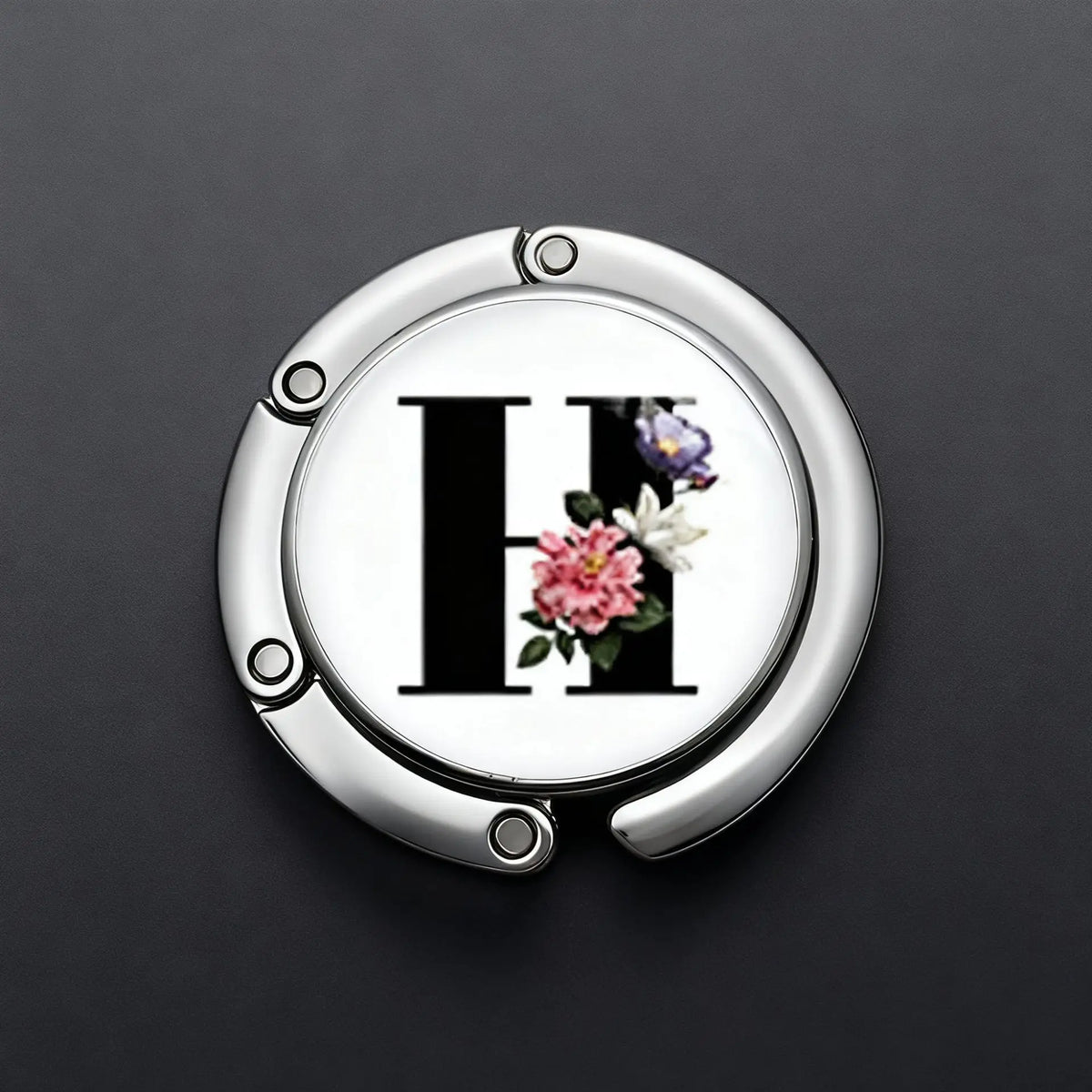 Silver foldable letter Hanger hook for accessories with a floral design.