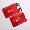 Two red anti-scan card sleeves for credit and RFID protection, with a black card visible.