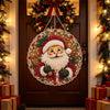 A decorative Christmas wreath featuring Santa Claus and holly, displayed on a wooden door.