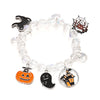 A bracelet featuring charms of a pumpkin, ghost, and spider on clear beads.