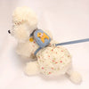 A fluffy white dog vest with a blue backpack and leash for small or medium breeds.