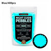 A sealed bag of blue glow-in-the-dark pebbles for outdoor decoration, labeled as a 400 piece pack.