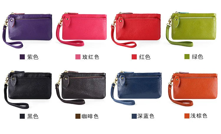 A collection of genuine leather wristlet clutch wallets in various colors including purple, pink, red, green, black, brown, d