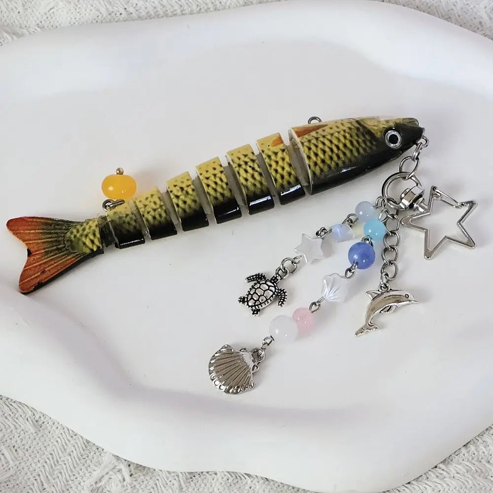 A simulation fish keychain featuring a realistic model of a fish with iridescent scales and a gold-colored body.