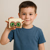 A young boy holds a beige Loungefly Avatar Momo cartoon zipper wallet.