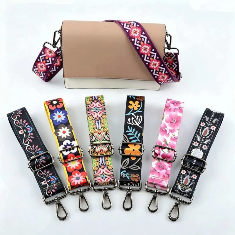 A beige leather handbag with a purple and white patterned strap is shown alongside several other colorful patterned straps.