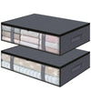 A set of three dark gray under bed storage organizer bins with light colored fabric inserts.