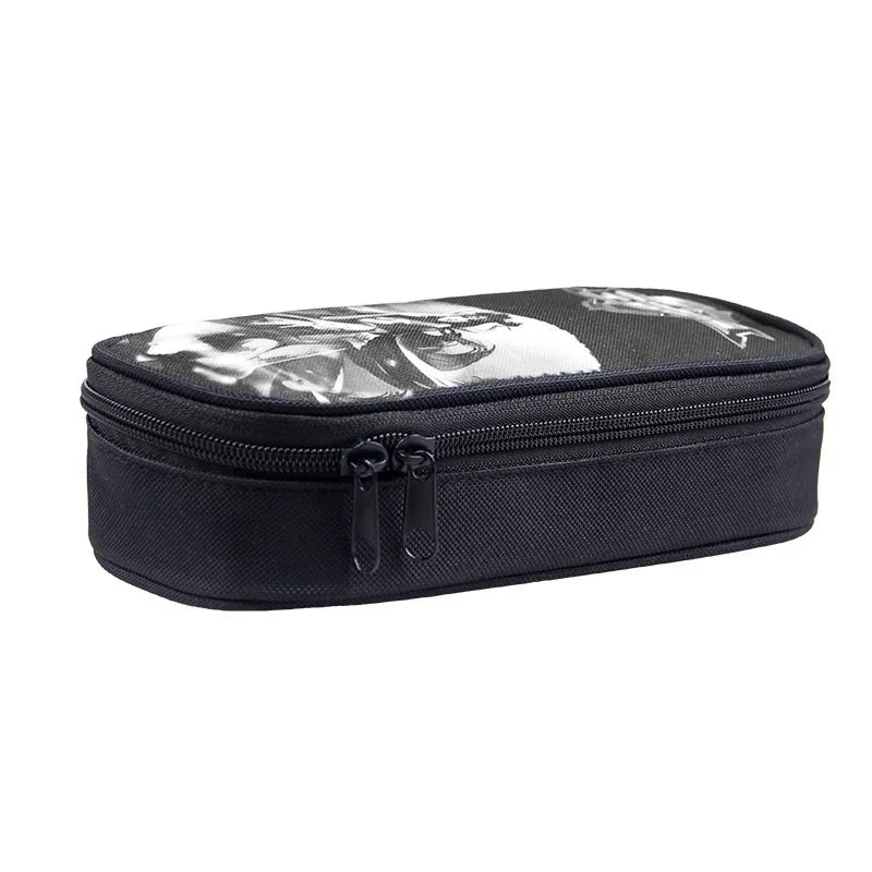 Black zippered pouch with a graphic print, part of a 3-piece kids school backpack set.