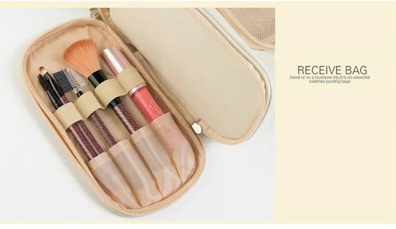 A beige travel pouch containing various makeup brushes and tools.