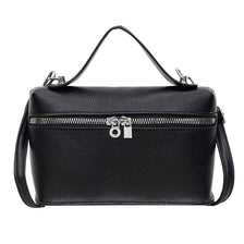 Black pebbled leather box crossbody bag with silver hardware and a long strap