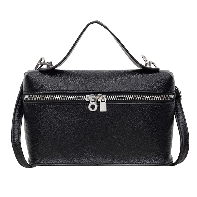 Black pebbled leather box crossbody bag with silver hardware and a long strap