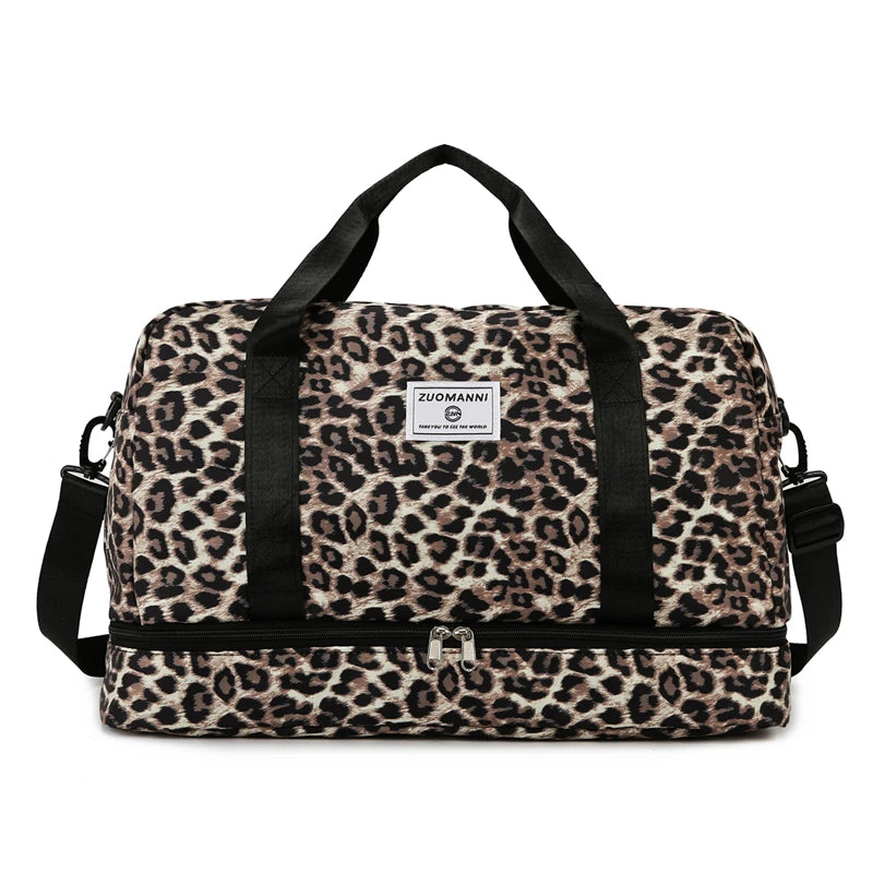A black leopard print travel duffel bag with handles and a zippered compartment.