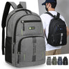 Gray and black lightweight commuter backpack shown on a person's back.