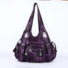 A purple vintage PU leather hobo shoulder bag with silver hardware.