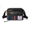 A dark blue waterproof nylon crossbody bag with a black strap and branding labels.