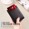A hand holds a black slim bifold wallet with a thumb hole, displaying a bank card.