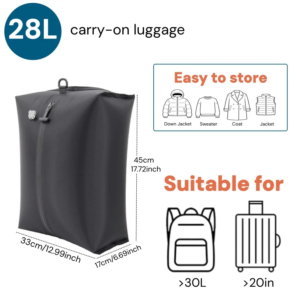 A black 28L carry-on luggage bag shown next to clothing items and a suitcase.